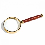 Handle magnifier with glass lens, gold-plated metal rim, 3xmagnification, Ø 50 mm.