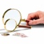 Handle magnifier with glass lens, gold-plated metal rim, 3xmagnification, Ø 50 mm.